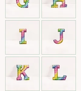 Colorful gradient pearl rhinestone alphabet letter patch DIY clothing bag accessory.