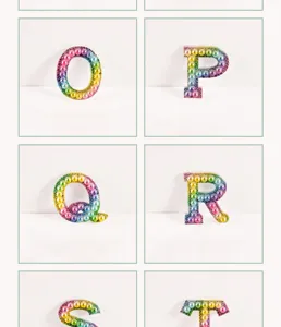 Colorful gradient rhinestone pearl alphabet DIY patches for clothing and bags detail view.