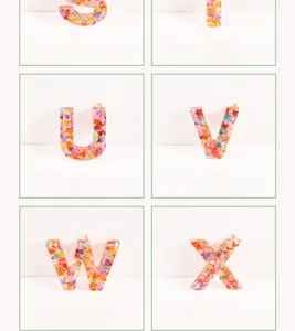 Resin epoxy alphabet charm detail showing colorful heart glitter inside letters S through X clearly.