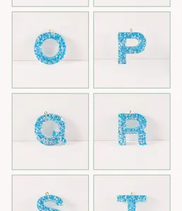 Blue resin alphabet letter pendant DIY jewelry accessory with iridescent shell flakes.