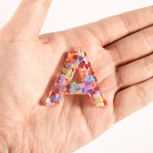 Resin letter A keychain charm filled with colorful heart sequins for DIY bag jewelry making.