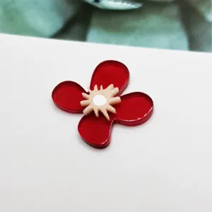Red acrylic flower charm for diy jewelry making, cute floral pendant accessory detail view.