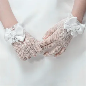 White lace fingerless gloves detail, featuring delicate satin bows and pearls for kids weddings.