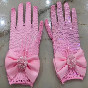 Pink mesh gloves for kids with big bow and pearl flower decoration, perfect for party and dress.