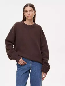 Womens autumn winter oversized crewneck knit sweater, dark brown model front view showcase.