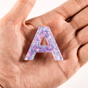 DIY resin glitter letter A keychain pendant, cute pink sparkling alphabet charm for bags.