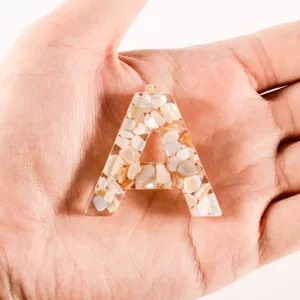 Resin shell letter A charm DIY keychain cute bag accessory fashionable handmade jewelry pendant.