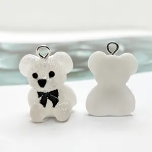 Cute white resin bear charm pendant with black bow for DIY jewelry making and keychains.