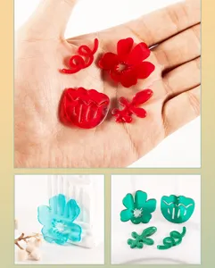 Close-up detail showing colorful acrylic flower and tulip charms for DIY shoe decoration.