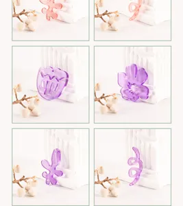 Close up details of colorful translucent acrylic charms, tulip and abstract floral DIY accessories.