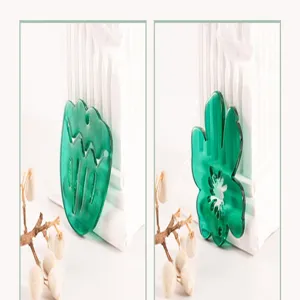 Green acrylic tulip leaf flower charm detail view for DIY shoe accessories and jewelry making.