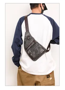 Vintage grey canvas chest bag with brown leather trim, multi-pocket crossbody sling bag.