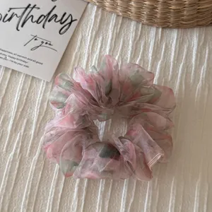 Retro fluffy organza floral hair scrunchie, soft texture detail for elegant daily hairstyles.