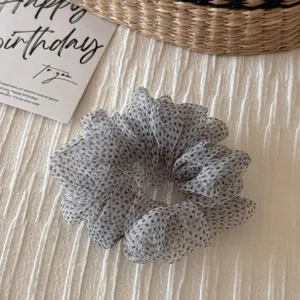Grey polka dot organza hair scrunchie detail view, fluffy texture, soft aesthetic hair tie accessory.