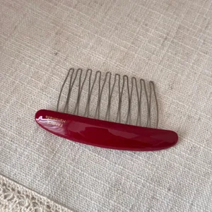 Oval acetate insert comb with metal teeth, stylish hair accessory for versatile daily hair styling.