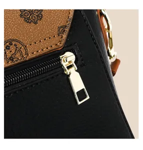 Detailansicht der Damen Vintage Umhängetasche mit weichem Leder und goldener Hardware.