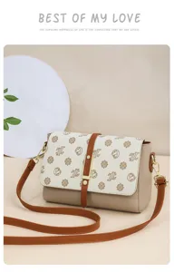 Stylish women vintage crossbody shoulder bag with unique print pattern and chic strap design.
