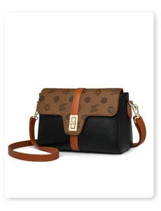 Sac bandoulière rétro pour femme, élégant sac d'épaule en cuir souple avec monogramme chic.