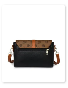 Sac bandoulière vintage classique pour femme avec rabat monogrammé élégant et cuir souple.