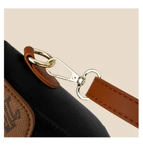 Detailed view of women's soft leather crossbody shoulder bag with luxury gold metal hardware.