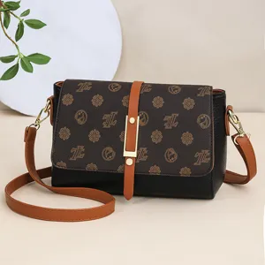 Women vintage crossbody bag, stylish retro monogram pattern shoulder bag with buckle.