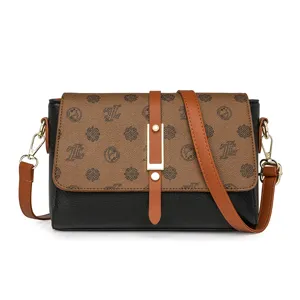 Women retro crossbody bag with monogram flap and black leather body, stylish daily purse.