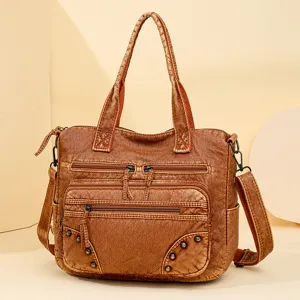 Vintage brown PU leather tote bag with multi pockets and shoulder strap for women daily use.