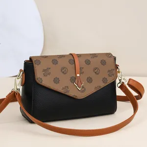 Fashion women shoulder bag with brown patterned flap and black leather crossbody design.