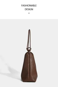 Brown woven tote bag with loop handle, stylish minimalist shoulder bag for commute.