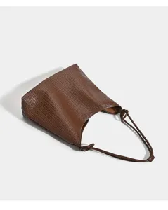 Brown woven textured hobo tote bag with knotted slim straps for daily commute casual chic
