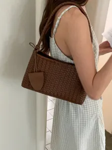 Stylish brown woven leather shoulder bag, trendy chic baguette handbag for daily commute.