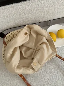 Handmade woven beach bag interior detail showing canvas lining and zip pocket.