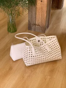 White woven cutout tote bag set, stylish summer resort underarm mother-child handbag detail.