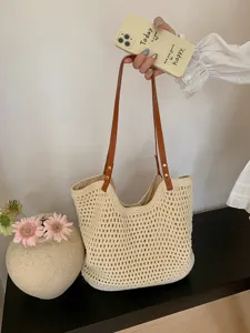 Handwoven straw tote bag for women, casual summer beach shoulder bag with leather straps.