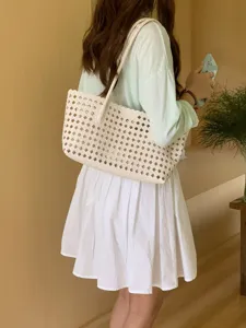 Chic woven shoulder tote bag for women, stylish hollow out summer casual underarm handbag.