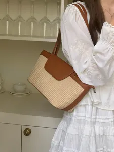 French retro straw woven shoulder bag detail view, chic summer beach casual tote bag design.