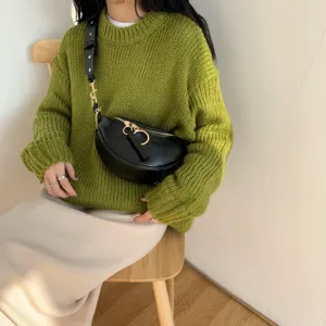 Trendy stylish black crescent waist bag with gold ring zipper and chain strap detail.