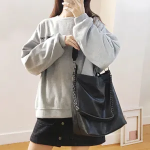 Stylish black chain shoulder bag, versatile large capacity bucket bag for women daily wear.