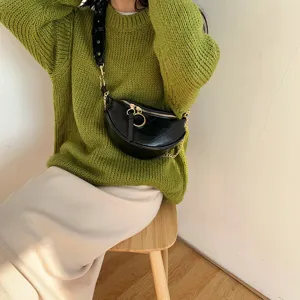 Trendy black crescent waist bag for women, versatile crossbody chain bag with stylish design.