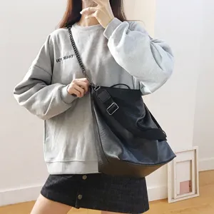 Stylish black PU leather bucket shoulder bag with chain strap for casual daily use.