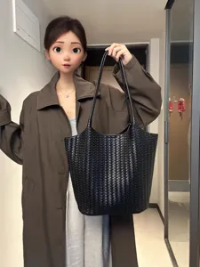 Black woven leather tote bag for women, large capacity shoulder bag for daily commuting and fashion.