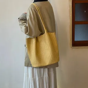 Yellow woven leather tote bag, large capacity stylish shoulder bag for daily commuting.