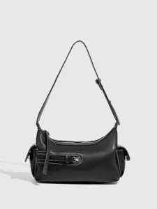 Stylish black leather shoulder bag with contrast stitching and pocket details for women.