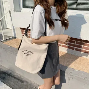 Borsa a tracolla casual in tela con cinturino a contrasto, elegante shopper per l'uso quotidiano.