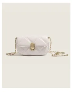 White quilted chain shoulder bag detail showing premium leather and golden hardware finish.