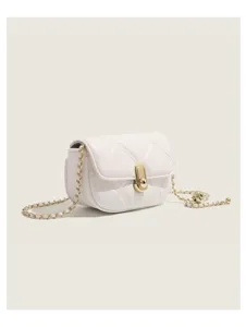 Detailed view of the white quilted shoulder bag showcasing its elegant gold chain and secure lock.