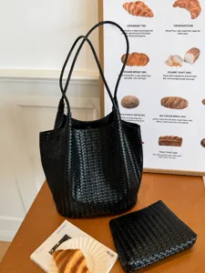 Black woven leather tote bag, large capacity shoulder bag for women daily commute style.