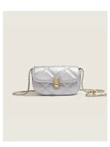 Detailed view of the silver quilted crossbody bag with stylish chain strap and lock.