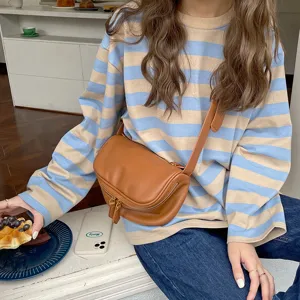 Stylish soft leather crossbody bag for women, chic wide strap and trendy daily wear design.