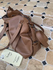 Brown leather travel duffel bag, large capacity tote shoulder crossbody bag detail view.